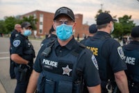 a group of police officers wearing face masks