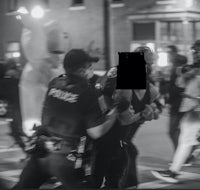 a black and white photo of a man being chased by police